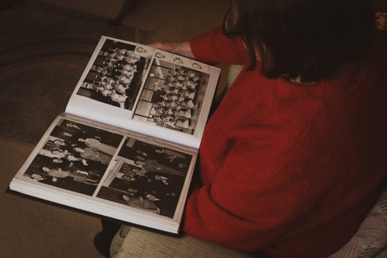 A woman looking through a photobook