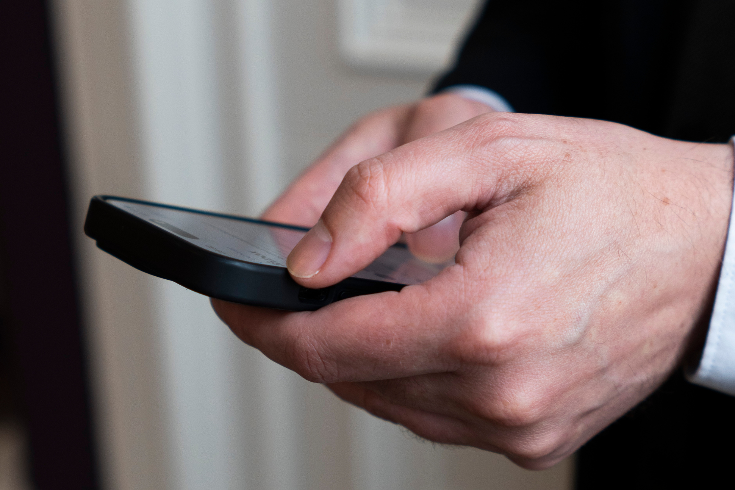 Hands holding a mobile phone